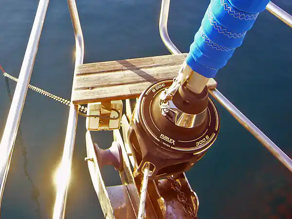 A furler drum at the bow of a sailboat